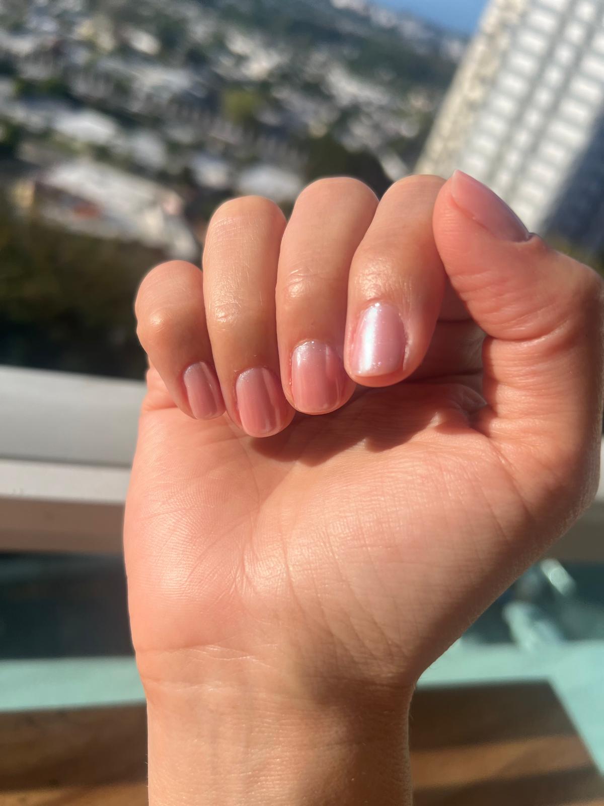 Pink chrome manicure.